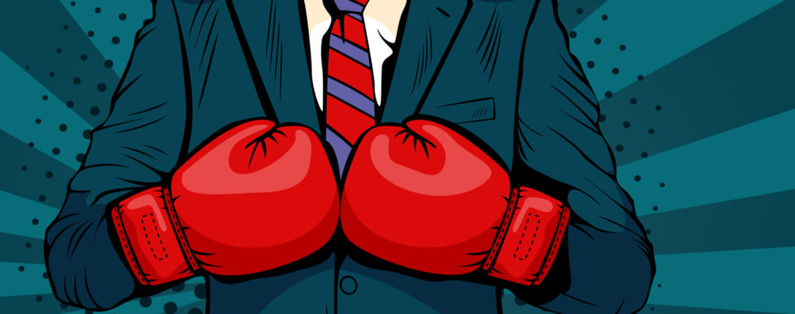 Kampf um die Marke: Business-Mann mit Boxhandschuhen